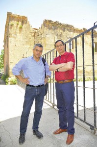 Ara Sarafian, left, and co-mayor Hüseyin Olan in front of the old Armenian Protestant church in Bitlis.