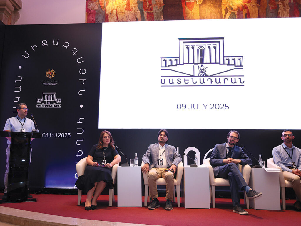 Dr. David Zakarian, left, speaking at the Armenological Congress held at the Matenadaran.